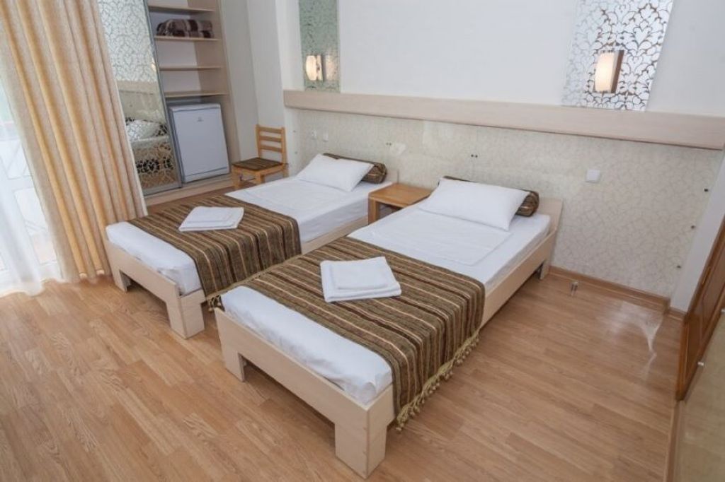 Ника — Двухместный номер с 2 отдельными кроватями двухместный стандартный номер с двумя отдельными кроватями и дополнительной кроватью