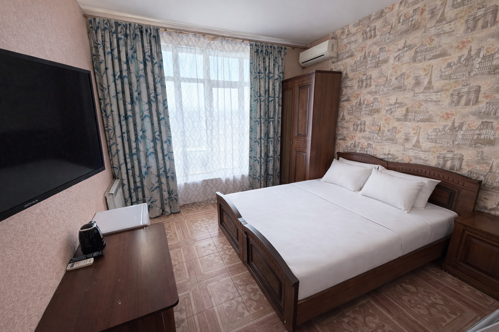 Аида — Четырёхместный номер улучшенный с видом на горы