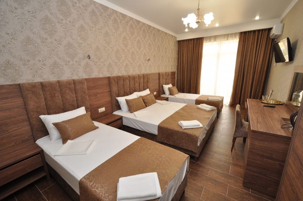 Манэ — Четырёхместный номер делюкс