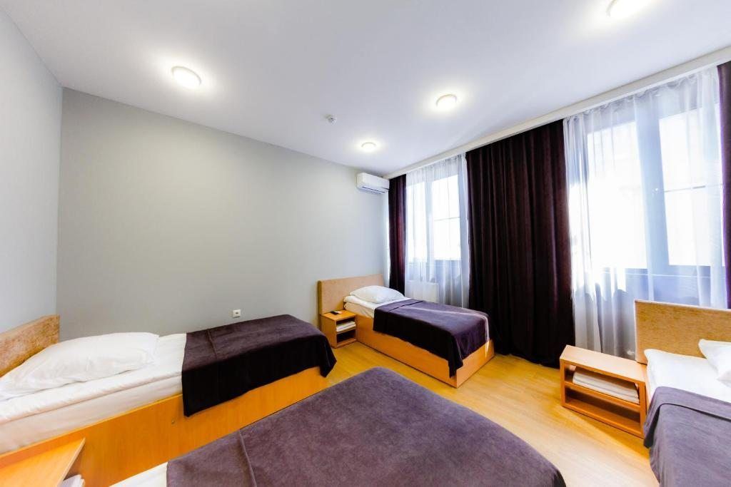 AFT — Четырёхместный номер с общей ванной комнатой