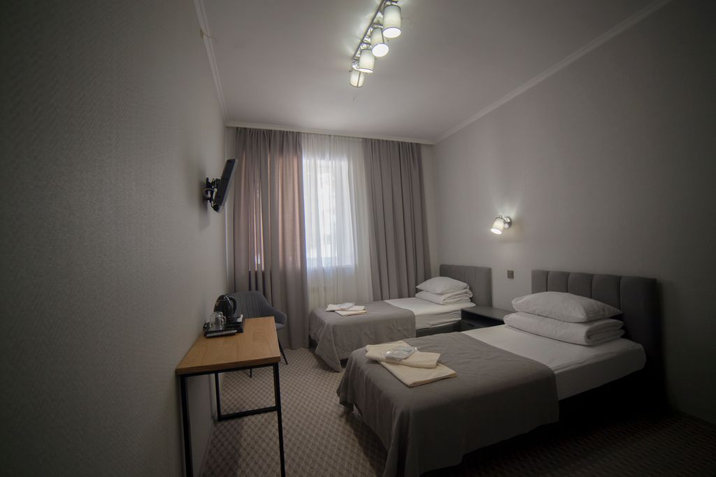 Альпина — Двухместный номер с 2 отдельными кроватями эконом в блоке