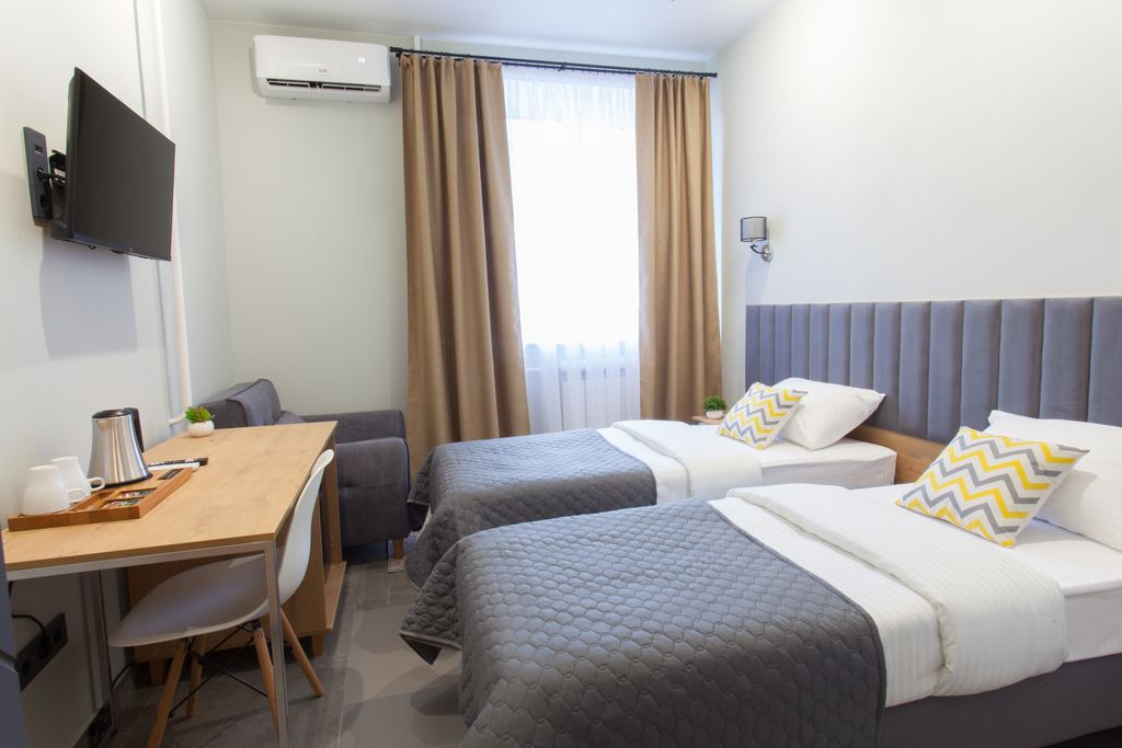 Атмосфера — Двухместный номер с 2 отдельными кроватями стандарт