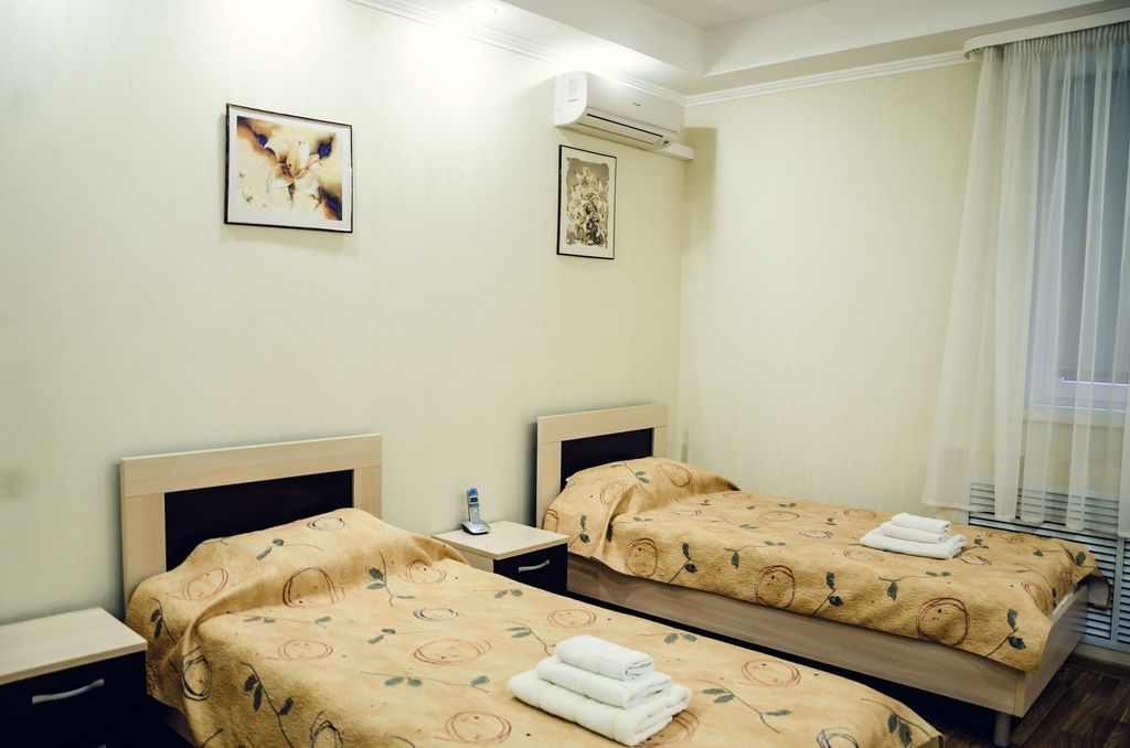 Олимпия — Двухместный номер с 2 отдельными кроватями улучшенный