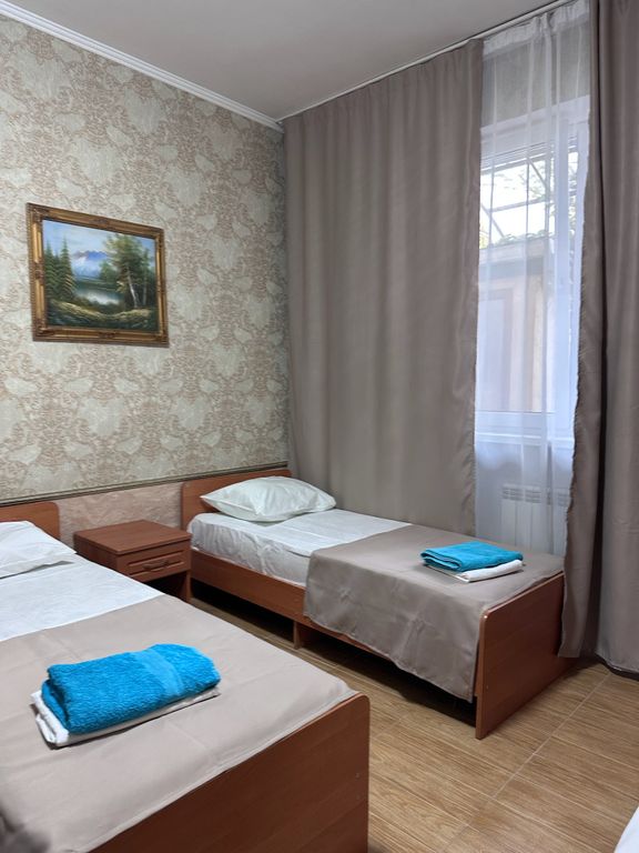 Ника — Трёхместный номер с односпальными кроватями