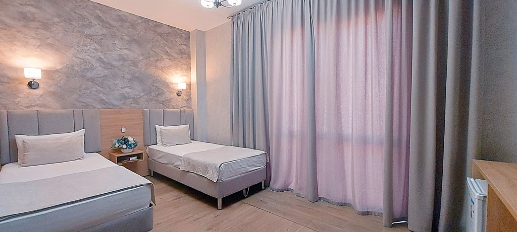 777 — Двухместный номер с 2 отдельными кроватями улучшенный с балконом