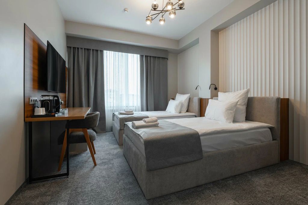 Континент — Двухместный номер с 2 отдельными кроватями Стандарт